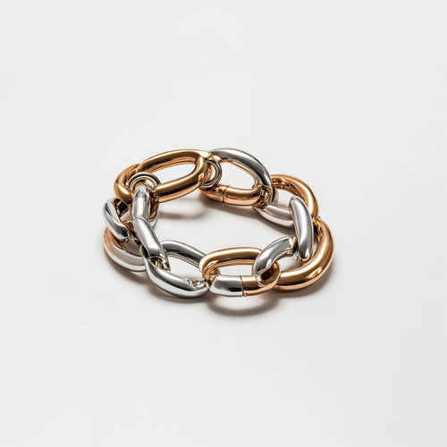 Two-tone chunky chain bracelet with silver and rose gold polished links on white background